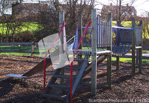 Image of wooden climbing frame with bark as a ground base