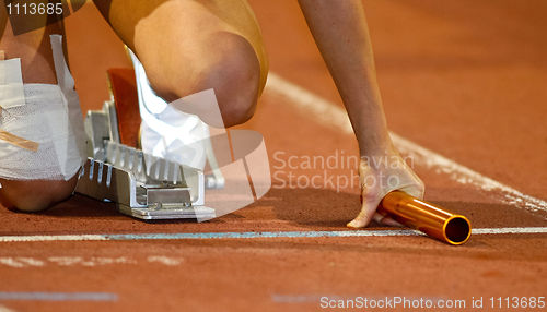 Image of Relay runner in the starting blocks