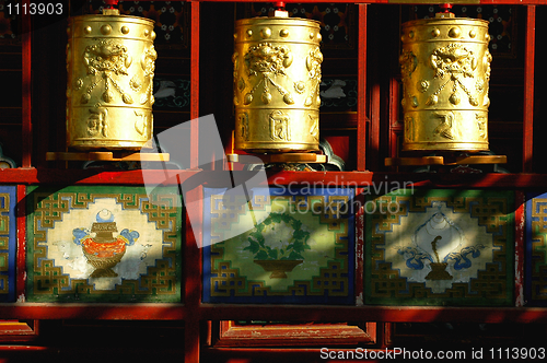 Image of Golden prayer wheels in Tibet