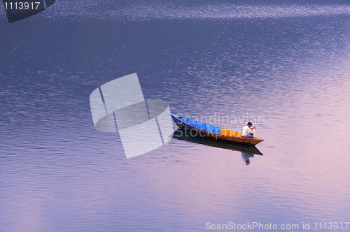 Image of Scenery of a lake with a fishing boat