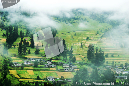 Image of Mountain village in a misty morning
