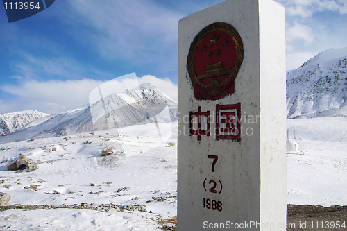 Image of China border stone in the snow mountains