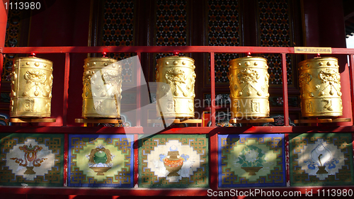 Image of Golden prayer wheels in Tibet