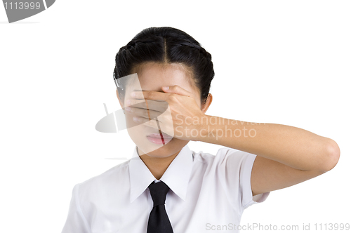 Image of businesswoman covering her eyes
