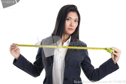 Image of business woman with ruler 