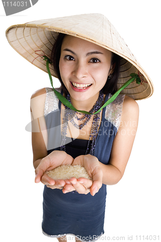 Image of  woman with rice in her hands