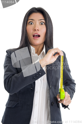 Image of surprised businesswoman with ruler
