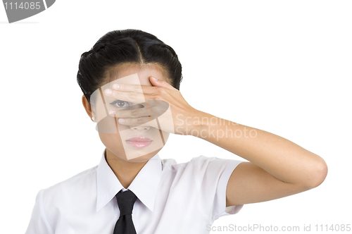 Image of businesswoman looking through her fingers