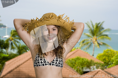 Image of teenager in front of a holiday resort