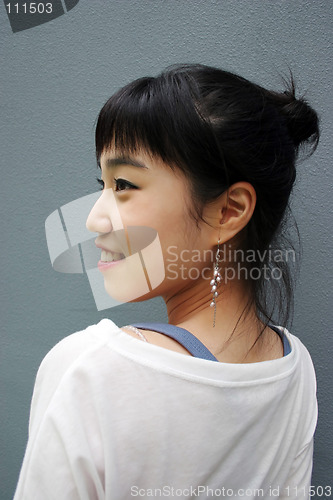 Image of Attractive young Korean woman with her head turned