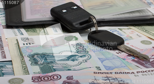 Image of Documents on the car and money.