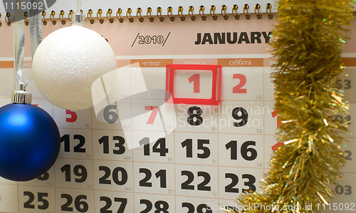 Image of Calendar and New Year's ornaments.