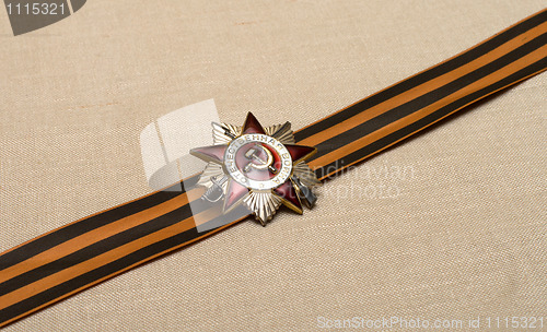 Image of Medal on a ribbon.