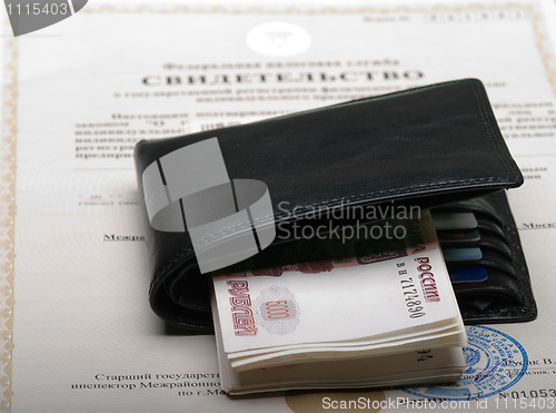 Image of document and money