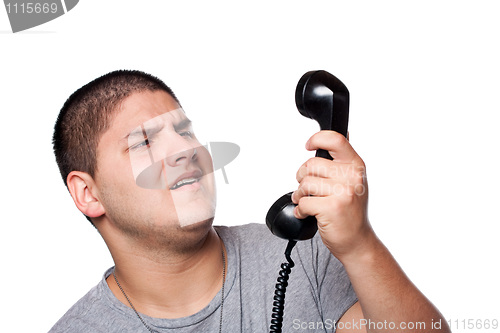 Image of Man Screaming Into the Telephone