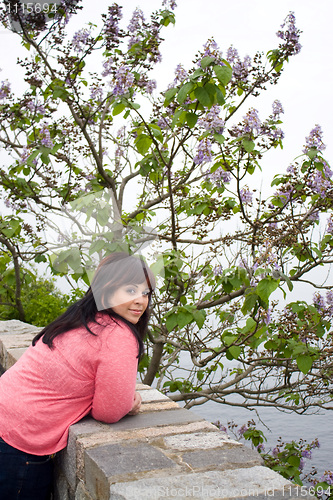 Image of Woman Leaning by the Sea