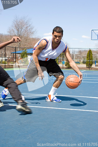 Image of Men Playing Basketball One On One