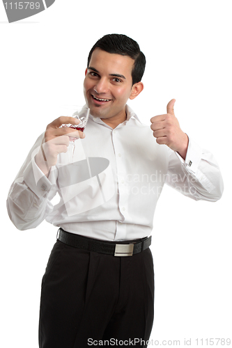 Image of Happy man thumbs up wine