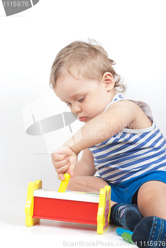 Image of boy with a toy