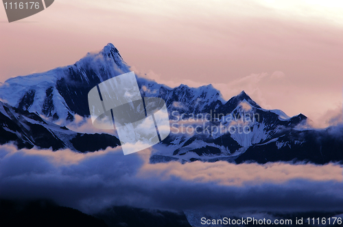 Image of Snow mountains in clouds