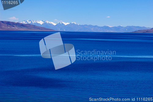 Image of Landscape of blue lake and snow covered mountains