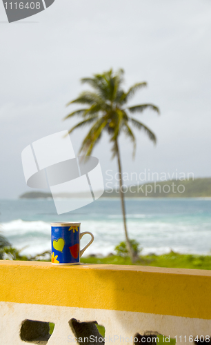 Image of colorful coffe cup over Caribbean Sea view Nicaragua