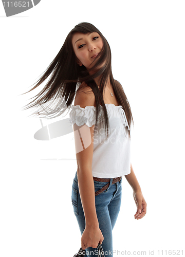 Image of Young carefree woman flicking hair