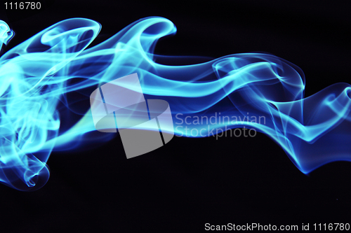 Image of Stream of a blue smoke on a black background 