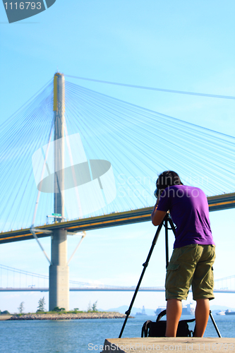 Image of photographer is shooting a bridge