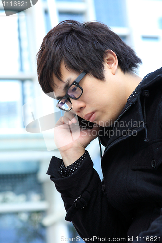 Image of Portrait of a young man with a phone 
