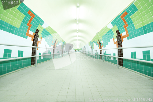 Image of long tunnel with lamps and nobody walking 