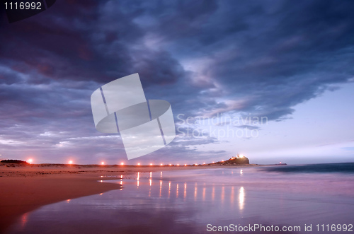 Image of lighthouse and breakwater at night