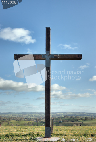 Image of christian cross of christ in field