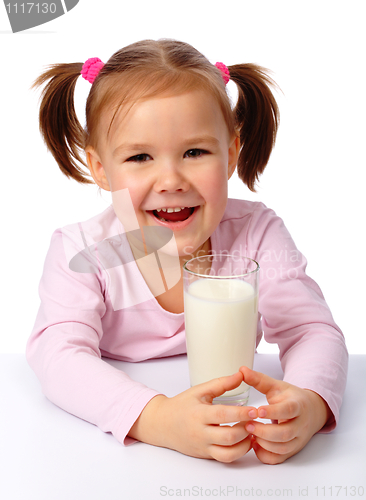Image of Little girl with a glass of milk