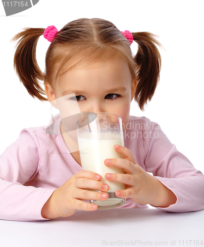 Image of Little girl drinks milk