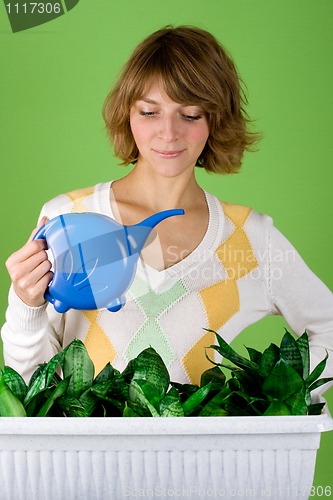 Image of girl watering flowers 