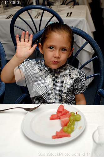Image of child at restaurant table