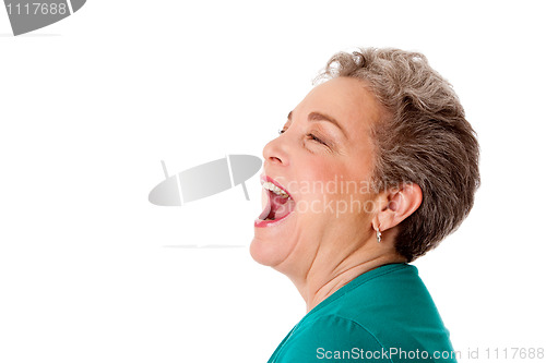 Image of Happy senior woman talking screaming yelling singing