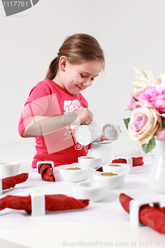 Image of Girl helps to set table