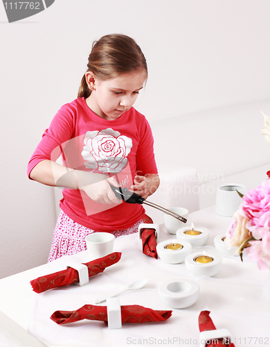 Image of Girl helps to set table
