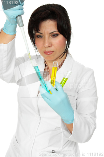 Image of Scientist, pipette and test tubes