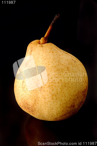 Image of Yellow Chinese pear on black background