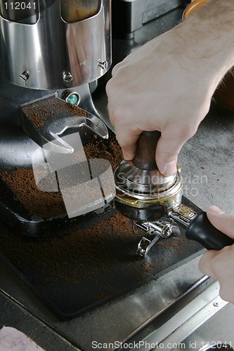 Image of Tamping Espresso Grounds