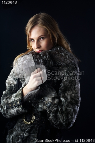 Image of Attractive woman in fur coat