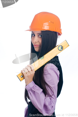 Image of Woman in helmet with level