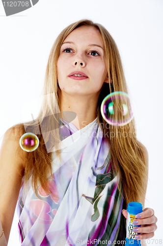 Image of Attractive girl with soap bubbles