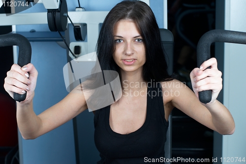 Image of Young woman in sport club