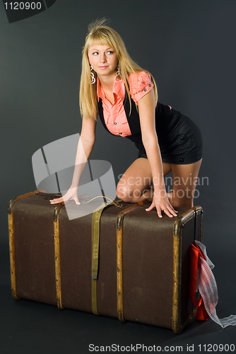 Image of Beautiful girl with suitcase