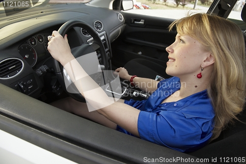 Image of Driving lady with smile