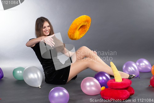 Image of Young woman with pyramid toy